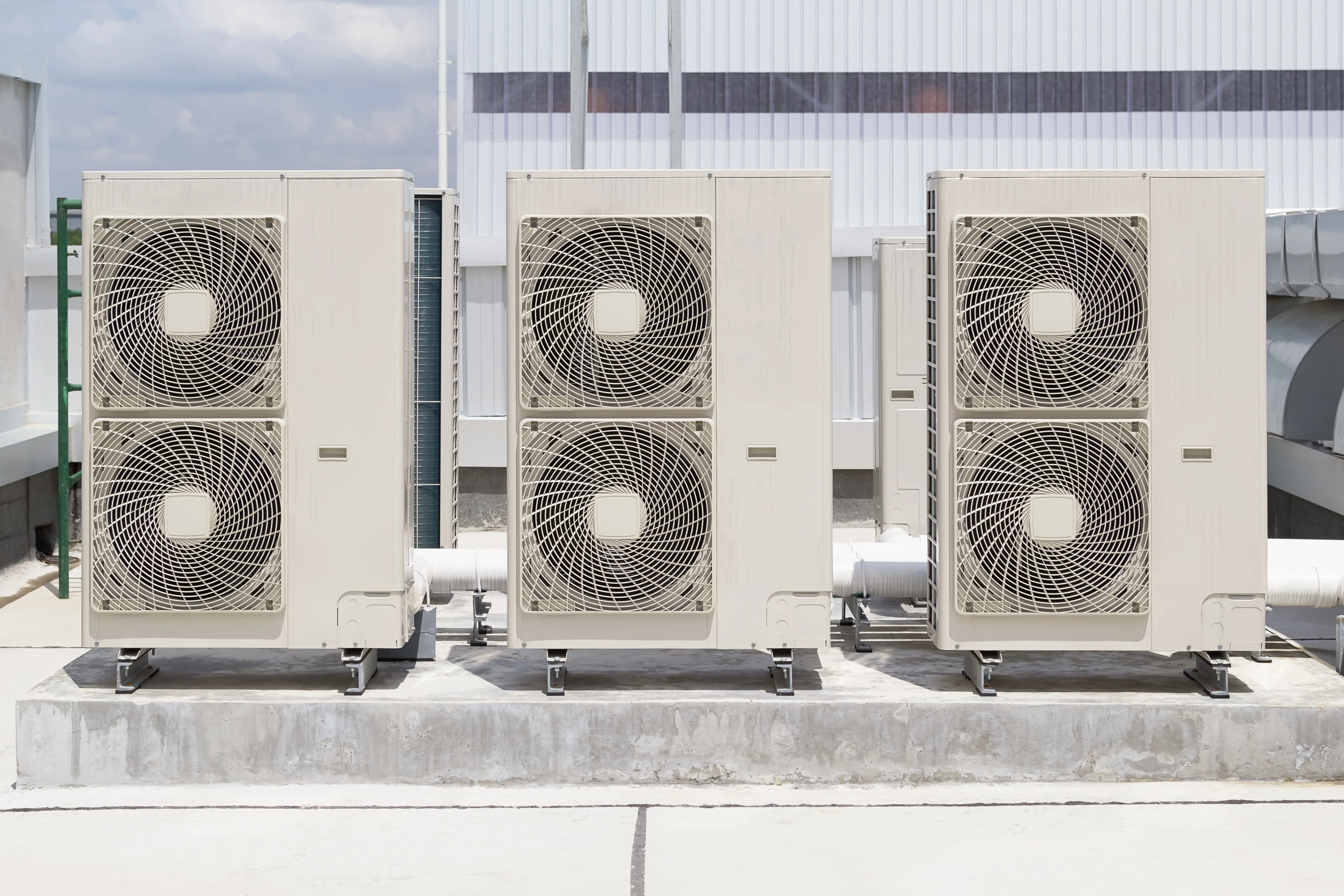 Rooftop HVAC units receiving professional commercial service in Tulsa.