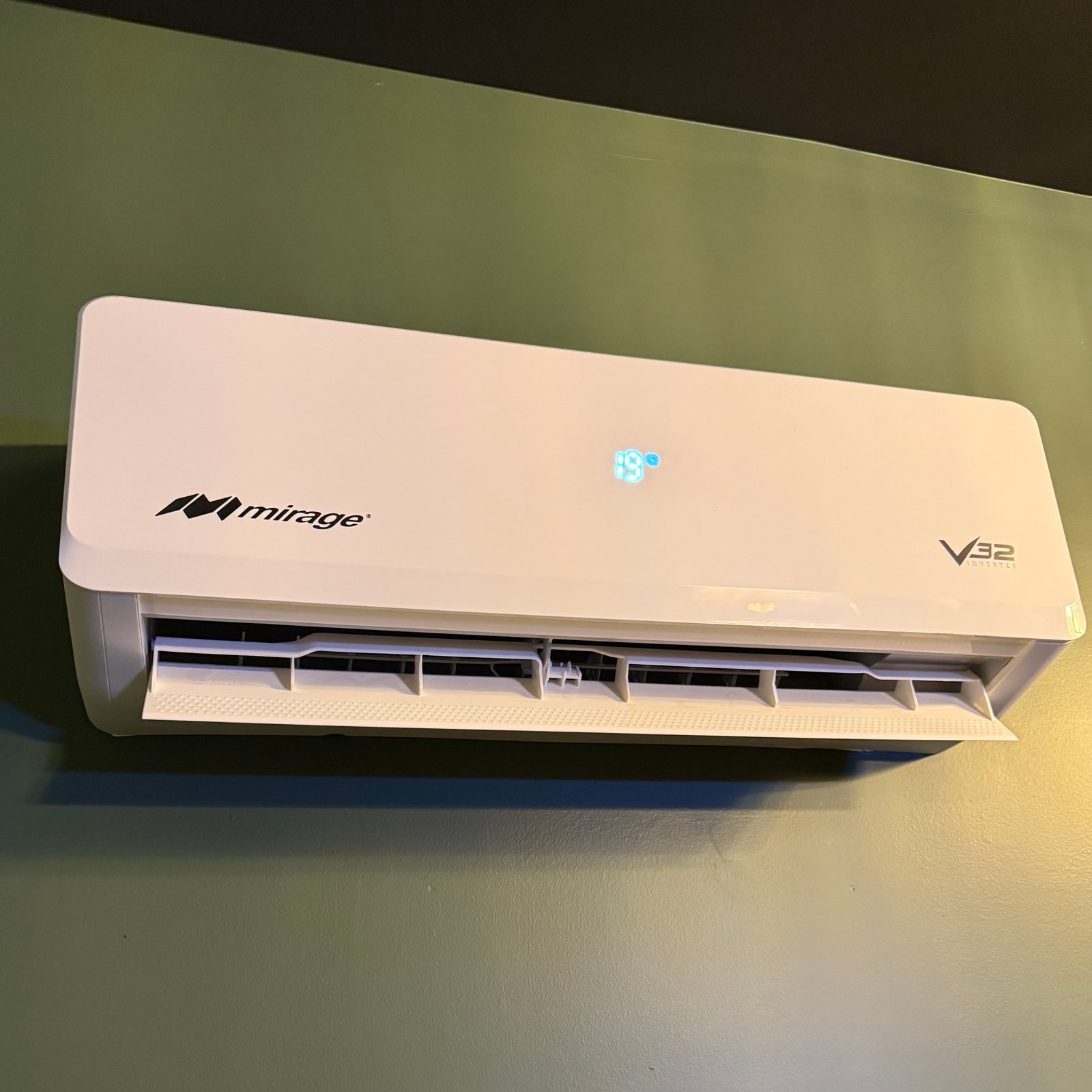 An Air Dynamics technician servicing an outdoor HVAC unit during an AC installation in Tulsa.